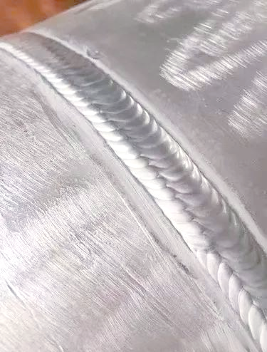 Aluminum welding defects vs proper weld (comparison)